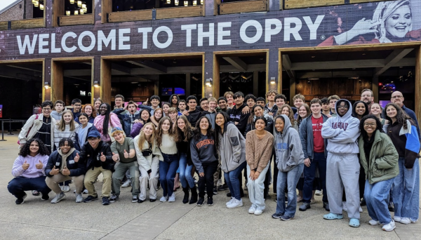 The Potomac Band poses in front of the Grand Ole Opry stage in Nashville, Tennessee 